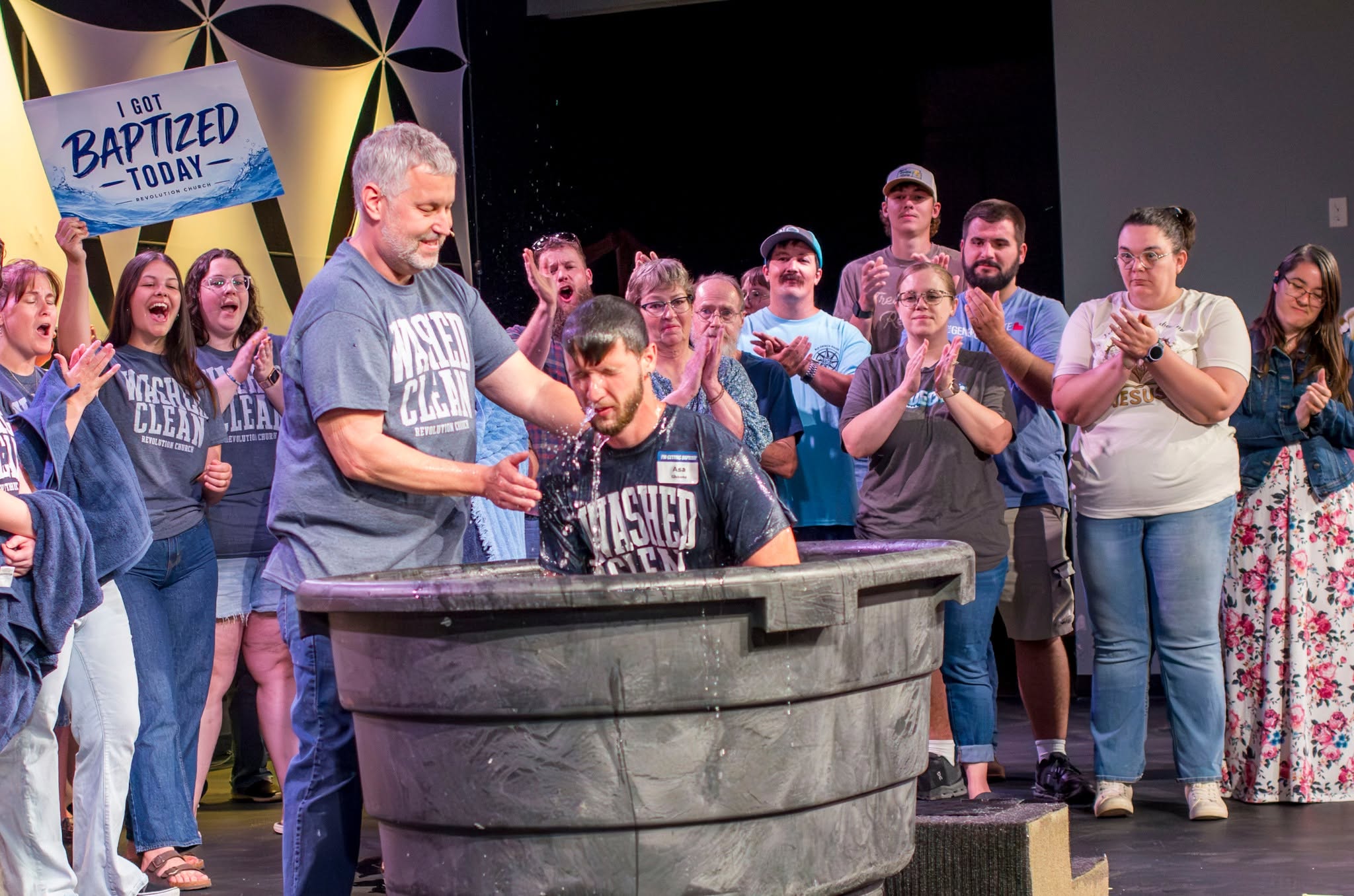 A baptism celebrated during a Revolution Church service in Salina, Kansas